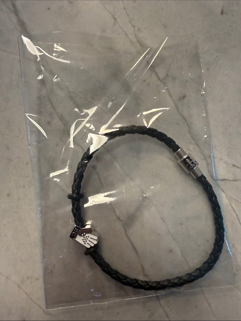 FIFA empty charm bracelet (with one charm on it).  Size Large, black.